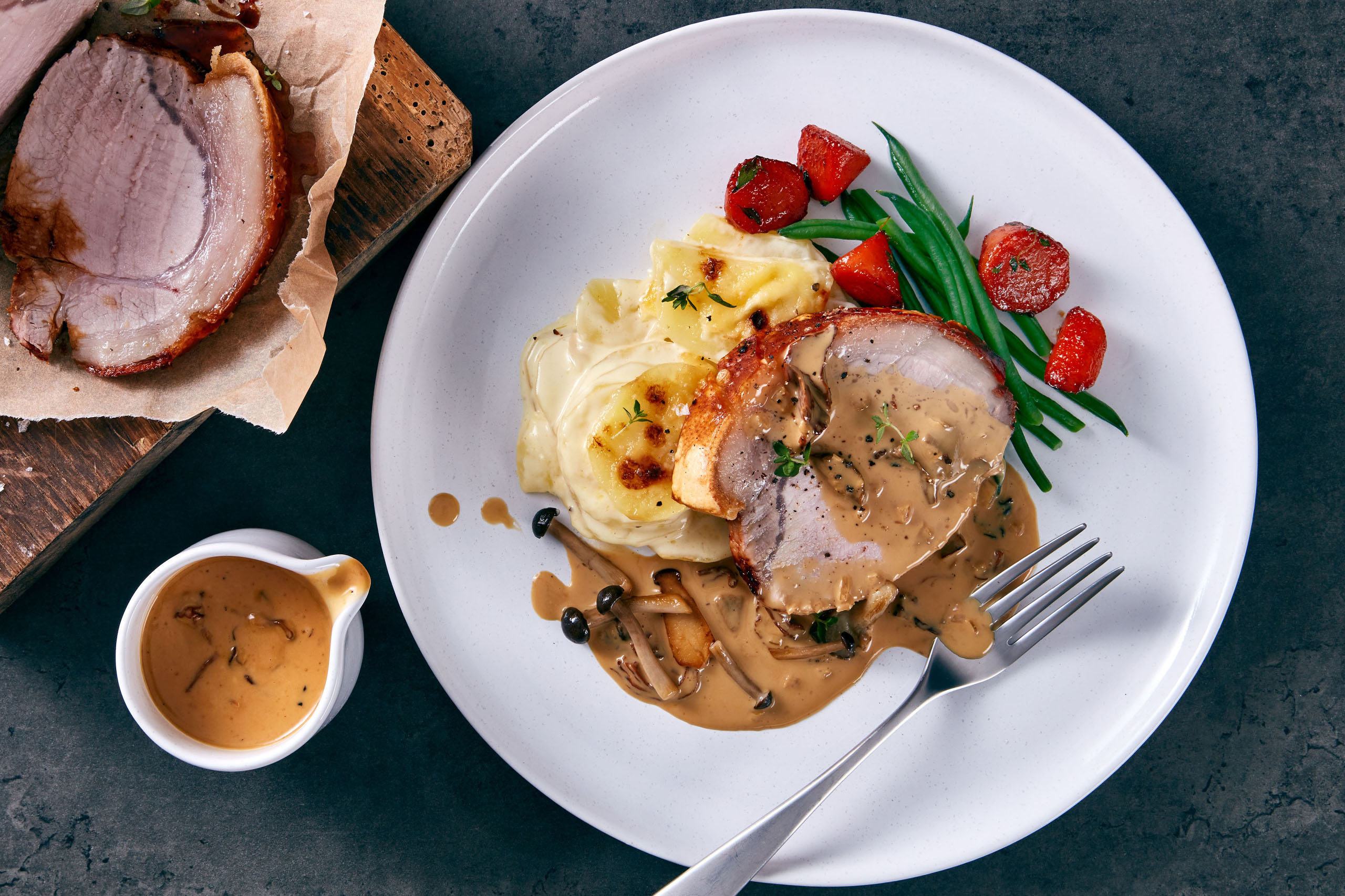 Roast loin of pork with wild mushroom sauce